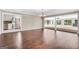 Large living space featuring hardwood floors, decorative lighting, and an open kitchen at 234 Crumbley Rd, Mcdonough, GA 30252