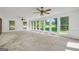 Bright living room featuring large windows with natural light and hardwood floors at 234 Crumbley Rd, Mcdonough, GA 30252