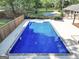 Aerial shot of a sparkling in-ground pool featuring concrete trim and a large backyard at 234 Crumbley Rd, Mcdonough, GA 30252