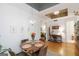 Cozy dining area with wood table, chandelier, and natural light; an inviting space for meals and gatherings at 1166 Virginia Avenue Northeast Ne Ave # 8, Atlanta, GA 30306