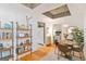Open-concept dining area with modern light fixture and views into the kitchen and bedroom at 1166 Virginia Avenue Northeast Ne Ave # 8, Atlanta, GA 30306