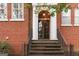 Charming front entrance featuring brick exterior, columns, and a glass door at 1166 Virginia Avenue Northeast Ne Ave # 8, Atlanta, GA 30306