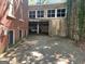 Carport and garage with a vintage blue car parked inside, showcasing unique architecture at 1166 Virginia Avenue Northeast Ne Ave # 8, Atlanta, GA 30306