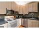 Well-equipped kitchen featuring stainless steel microwave and a gas range at 1166 Virginia Avenue Northeast Ne Ave # 8, Atlanta, GA 30306