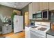 Efficient kitchen area featuring stainless steel microwave and adjacent refrigerator at 1166 Virginia Avenue Northeast Ne Ave # 8, Atlanta, GA 30306