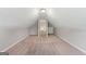 Finished attic space with neutral carpet, paint, built in cabinets, and a vaulted ceiling at 1032 Shumard Ln, Mcdonough, GA 30252