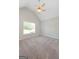 Bedroom featuring a vaulted ceiling, carpet, neutral walls, and natural light from a window at 1032 Shumard Ln, Mcdonough, GA 30252