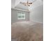 Bright bedroom with a ceiling fan and window offers a calm and relaxing space at 1032 Shumard Ln, Mcdonough, GA 30252