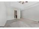 Large bedroom with neutral carpet and decor offers a serene retreat, adjacent to an en-suite bathroom at 1032 Shumard Ln, Mcdonough, GA 30252