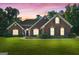 Charming single-story red brick home with manicured lawn at sunset at 1032 Shumard Ln, Mcdonough, GA 30252