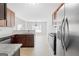 Well-lit kitchen features stainless steel appliances and granite countertops, perfect for cooking and entertaining at 1032 Shumard Ln, Mcdonough, GA 30252