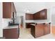 Spacious kitchen boasts brown cabinets, granite countertops and stainless appliances at 1032 Shumard Ln, Mcdonough, GA 30252