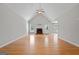 Spacious living room with a fireplace, hardwood floors, and vaulted ceilings at 1032 Shumard Ln, Mcdonough, GA 30252