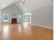 Spacious living room with hardwood floors, vaulted ceilings, and fireplace at 1032 Shumard Ln, Mcdonough, GA 30252