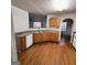 Functional kitchen featuring wood cabinets, white appliances, and a bright window at 7471 Garnet Dr, Jonesboro, GA 30236