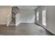 Unfinished basement with stairs, window, and door leading to backyard at 4464 Eastbrook Pl # 56B, Snellville, GA 30039