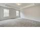 Bright carpeted bedroom featuring large bright windows and neutral decor at 4464 Eastbrook Pl # 56B, Snellville, GA 30039