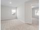 Comfortable carpeted bedroom with bright windows and ample closet space at 4464 Eastbrook Pl # 56B, Snellville, GA 30039