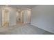 Bright carpeted hallway with access to a bathroom featuring tile and shower at 4464 Eastbrook Pl # 56B, Snellville, GA 30039