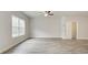 Main bedroom with neutral paint, LVP floors, and large windows at 4464 Eastbrook Pl # 56B, Snellville, GA 30039