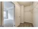 Bright walk-in closet with shelving next to the bedroom with a tray ceiling at 4464 Eastbrook Pl # 56B, Snellville, GA 30039