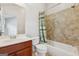 Cozy bathroom featuring a combined shower and tub, classic vanity, and neutral-toned tiled walls at 1278 Discover Green Lane Ln # 7, Mableton, GA 30126