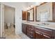 Elegant bathroom with dual vanities, granite countertops, dark wood cabinets, and a tiled floor at 1278 Discover Green Lane Ln # 7, Mableton, GA 30126