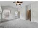 Bright bedroom with a ceiling fan, soft carpeting, and multiple windows for ample natural light and street views at 1278 Discover Green Lane Ln # 7, Mableton, GA 30126