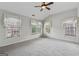 Spacious bedroom featuring vaulted ceilings, three windows with charming curtains, and soft neutral carpeting at 1278 Discover Green Lane Ln # 7, Mableton, GA 30126