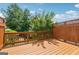 Exterior view of a wooden deck surrounded by a wooden fence and lush greenery, providing a private outdoor space at 1278 Discover Green Lane Ln # 7, Mableton, GA 30126