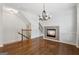 Elegant dining room featuring hardwood floors, a fireplace and staircase access at 1278 Discover Green Lane Ln # 7, Mableton, GA 30126