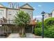 Townhome with a private drive and garage below and a wood deck overlooking lush greenery at 1278 Discover Green Lane Ln # 7, Mableton, GA 30126