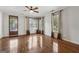 Bright living room with hardwood floors and large windows, complemented by neutral-toned curtains at 1278 Discover Green Lane Ln # 7, Mableton, GA 30126