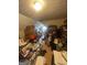 Attic cluttered with boxes, books, and furniture, taking up most of the available space at 733 Stonehaven Chase, Mcdonough, GA 30253