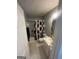 Cozy bathroom featuring a shower-tub combo with stylish curtain, and a classic vanity with white cabinet and sink at 733 Stonehaven Chase, Mcdonough, GA 30253