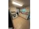 Efficient kitchen with white cabinetry, tile flooring, and functional appliances at 733 Stonehaven Chase, Mcdonough, GA 30253