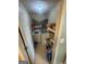Efficient laundry area with washer, dryer, shelving, and ample storage space at 733 Stonehaven Chase, Mcdonough, GA 30253
