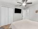 Bedroom featuring a bed, mounted TV, and closet with white doors at 1000 Coan Dr, Locust Grove, GA 30248