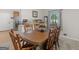 Charming dining room featuring a wooden table, six chairs, and a sunlit window at 1000 Coan Dr, Locust Grove, GA 30248