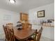 Cozy dining room features a wooden table set for six, with neutral wall color at 1000 Coan Dr, Locust Grove, GA 30248