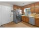 Kitchen area featuring stainless steel refrigerator, neutral cabinets, and a tile floor at 1000 Coan Dr, Locust Grove, GA 30248