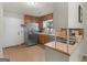 Functional kitchen featuring stainless steel appliances, wood cabinets, and a tile floor at 1000 Coan Dr, Locust Grove, GA 30248