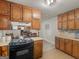 Charming kitchen featuring neutral cabinetry and countertops with views into the dining room at 1000 Coan Dr, Locust Grove, GA 30248