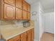 Well-lit kitchen features light wood cabinets and countertops, with a convenient pantry at 1000 Coan Dr, Locust Grove, GA 30248