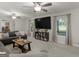 Bright living room with comfortable seating, carpeted floors, and lots of natural light at 1000 Coan Dr, Locust Grove, GA 30248