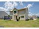 Spacious backyard with a trampoline, grill, and a well-manicured lawn at 116 Sophie Cir, Locust Grove, GA 30248