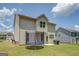 Spacious backyard with a trampoline, grill, and a well-manicured lawn at 116 Sophie Cir, Locust Grove, GA 30248