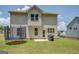 Spacious backyard with a trampoline, grill, and a well-manicured lawn at 116 Sophie Cir, Locust Grove, GA 30248
