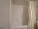 Well-maintained bathtub and shower combination with a light-colored shower curtain at 116 Sophie Cir, Locust Grove, GA 30248