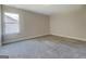 Bright, carpeted bedroom with a neutral palette, ready for personalization and comfort at 116 Sophie Cir, Locust Grove, GA 30248